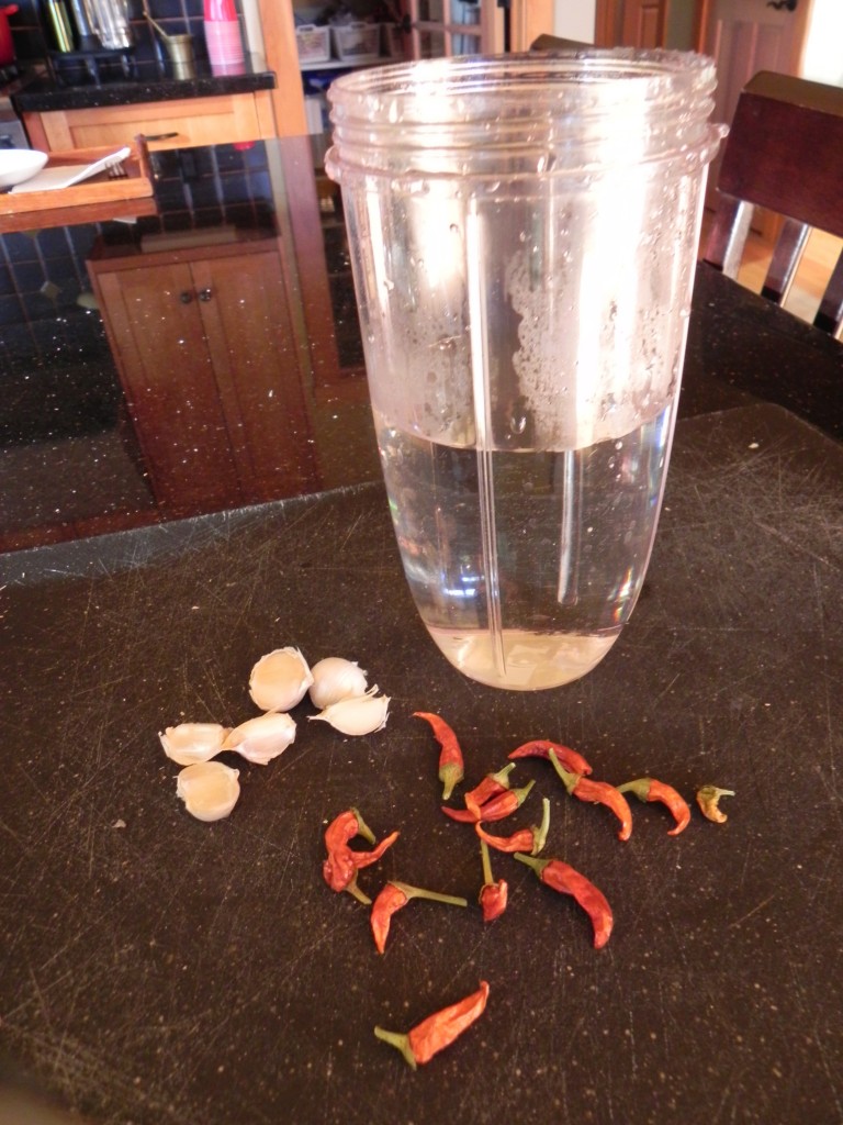 Peppers and garlic soak in water overnight.