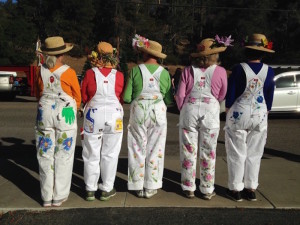 Cambria Garden Club members wear hand-painted coveralls.